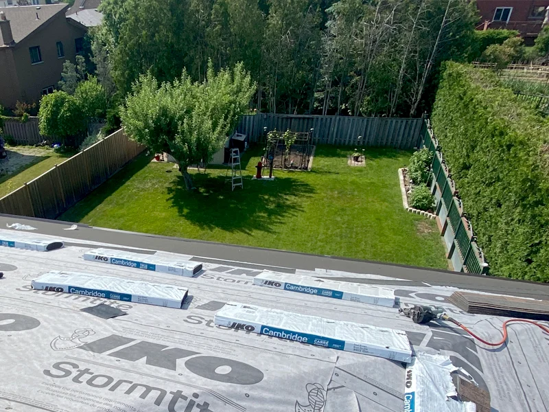 Local Roofing Experts installing a roofing in Dundas Ontario from a backyard view image